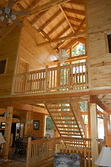 spacious deck with picnic table and rocking chairs